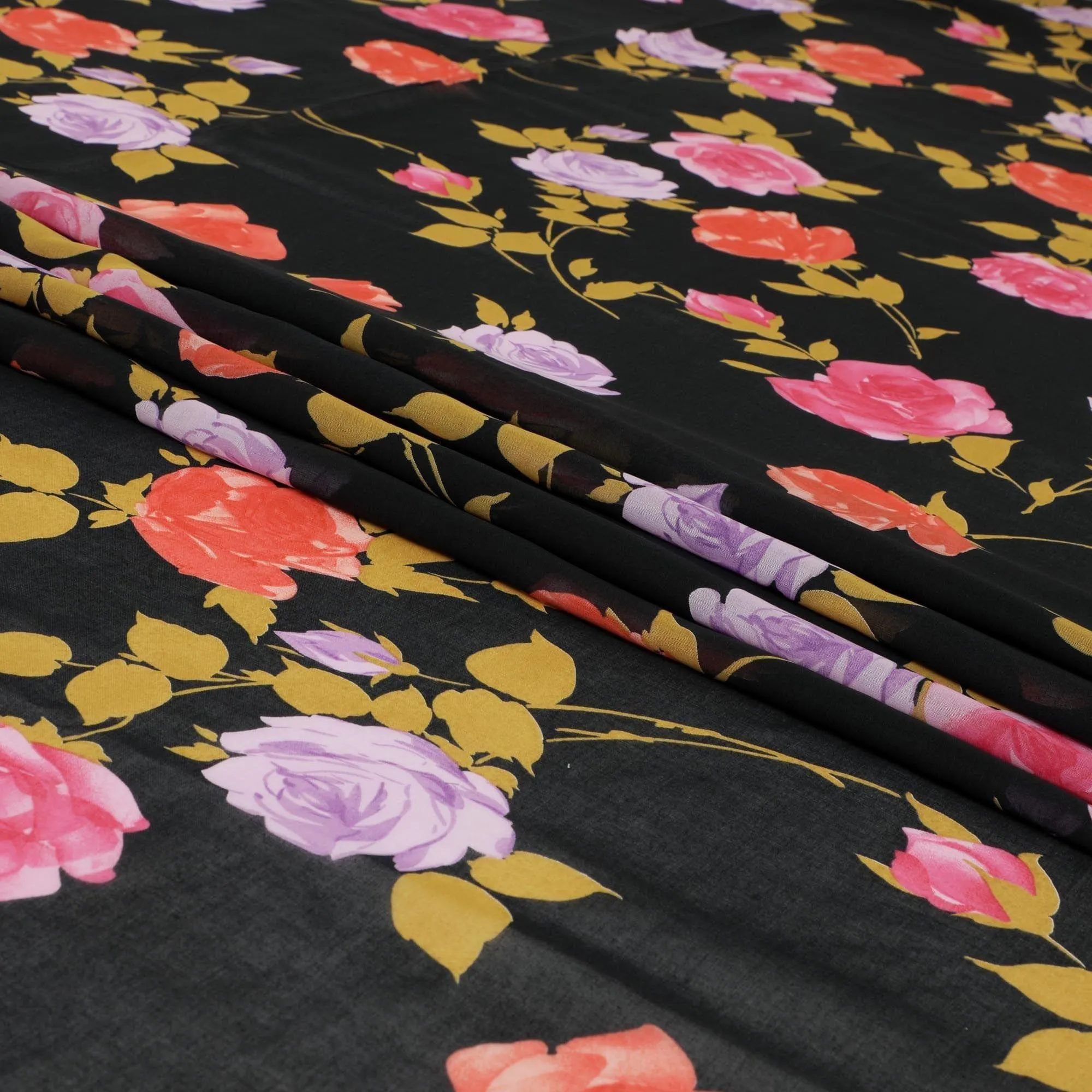 Black Swiss cotton voile fabric with gold, creamy pink and lilac print in floral design