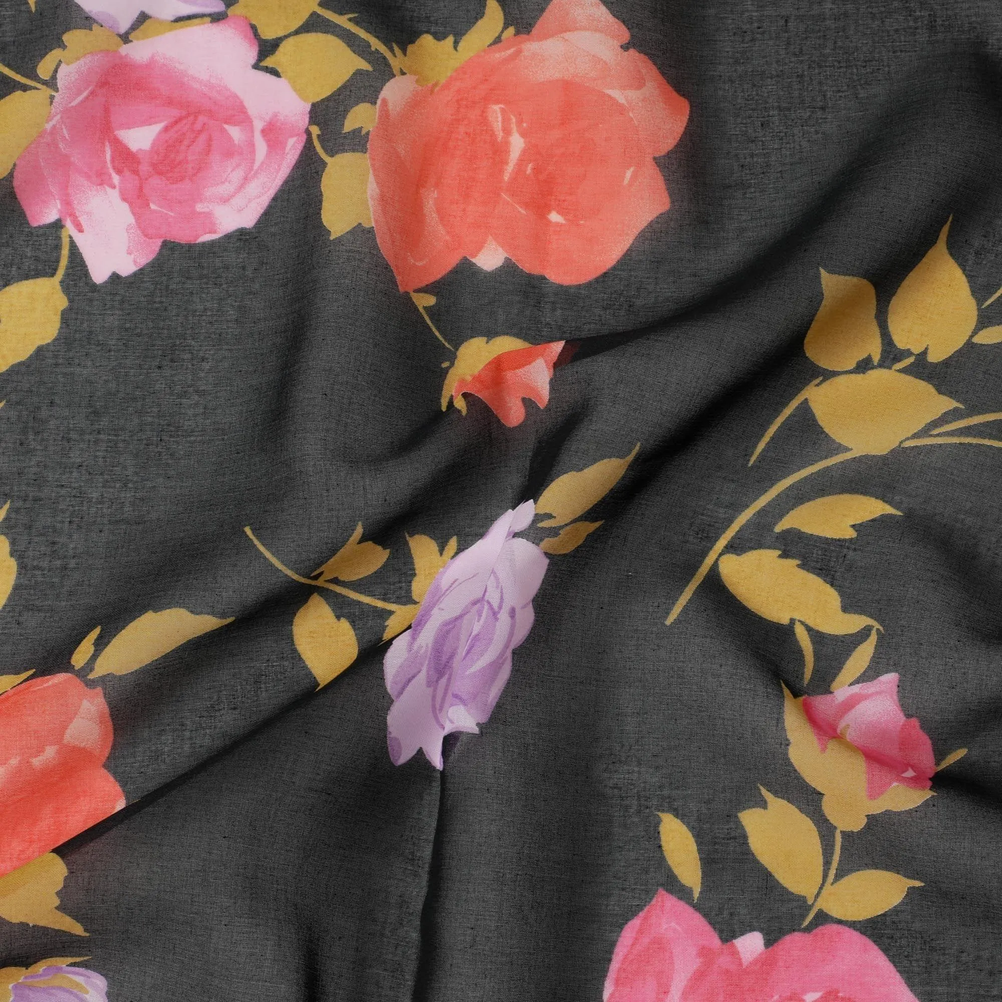 Black Swiss cotton voile fabric with gold, creamy pink and lilac print in floral design